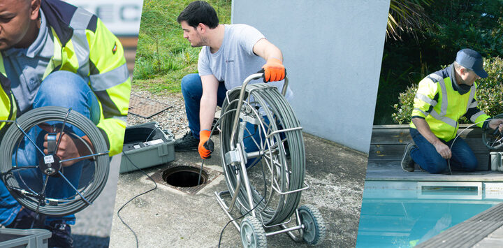 Techniciens déroulant le jonc d'une caméra de poussée au-dessus d'un regard de canalisation